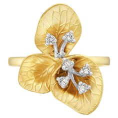 Introducing our exquisite Clover Leaves Shaped Carved Ring, crafted with the utmost attention to detail and made in high-quality 14k yellow gold. This ring features a stunning design of intricately carved clover leaves, adding a touch of natural beauty and femininity to the piece. 14KT:4.714g, Diamond:0.15ct Luxury Elegant Leaf-shaped Jewelry, Yellow Gold Plated Flower-shaped Jewelry, 14k Yellow Gold Leaf-shaped Jewelry, Luxury Yellow Gold Leaf-shaped Jewelry, Gold Plated Leaf-shaped Jewelry, Clover Leaves, Jewelry 2024, Brighter Days, Carved Ring