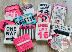 several decorated cookies with different types of signs on top of each one and the words speed limit