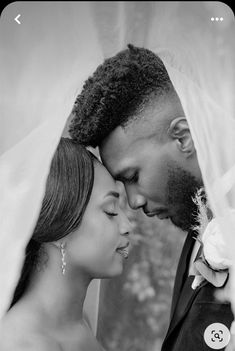 a black and white photo of a bride and groom