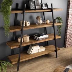 a wooden shelf with books and plants on it next to a brick wall in a living room