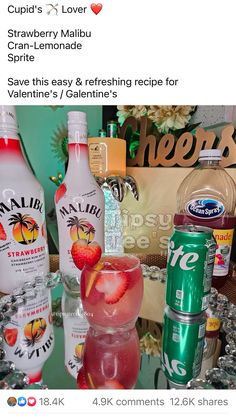 a table topped with lots of different types of drinks next to bottles and cans on top of each other