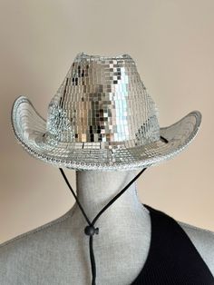 You'll be turning heads if you are heading to the a concert with this stunning Disco Ball  Cowboy  Hat .Add sparkle and glamour  to your outfit with this high quality disco cowboy hat made with thousands of  mosaic tiles. Measures about 15.75 in x 13.5 in x 5.5 in, hat circumference about 58 cm that fits most heads.   All hats are handmade ! A true statement piece that can be worn going to a concert, festival, rodeo, a bachelorette party or just need a stylish accessory  to complete your look.  Cowgirl Hat, Disco Hat , Performance, Festival, Rodeo, Fashion, Accessory, Statement Piece, Sparkle, Glamour,  Wearable Art, Bold and Bright Disco Cowboy Hat, Disco, Silver Disco Hat, Sparkly Cowgirl Hat,  Silver Cowboy Hat, Cowboy Disco Hat, Disco Ball Hat , Halloween Costume, Concert sparkly hats, Holographic Cowboy Hat, Luxury White Cowboy Hat For Western-themed Events, Custom Cowboy Hats Space, Brimmed Party Costume Hats And Headpieces, Party Hat With Flat Brim, Adjustable Brimmed Party Hats, Party Hat With Short Brim, One Size Fits Most, Party Hat With Flat Brim, One Size Fits Most, Party Bucket Hat, One Size Fits Most