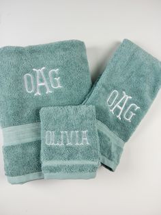 three towels with the word ogg written on them