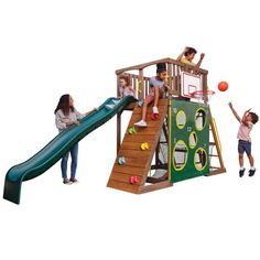 children playing on a wooden play set with a basketball hoop and climbing wall, while an adult plays in the background