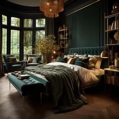 a bedroom with green walls and wooden flooring has a large bed in the center