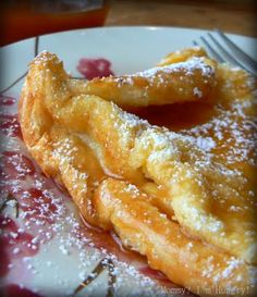 powdered sugar covered pastry on a plate