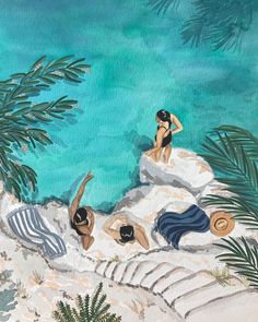 two women in bathing suits are sitting on rocks near the water and palm trees, while another woman is standing behind them