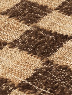 closeup of the brown and white checkered rug