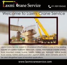 a crane is sitting in front of a construction site with the words welcome to laxmi crane service