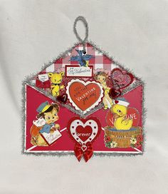 a red envelope decorated with hearts and pictures