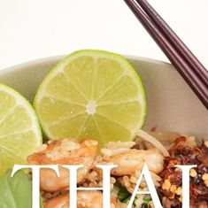 a bowl filled with shrimp and rice next to chopsticks on top of it