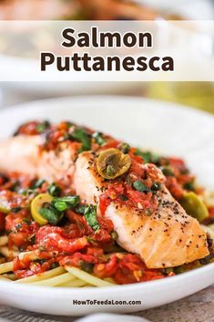 salmon with tomato sauce and pasta in a white bowl