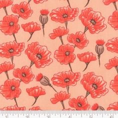 an orange and red flower pattern on a light pink background, with a ruler in the foreground