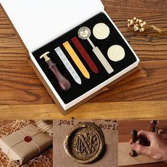 an assortment of different items in a box on a wooden table with other things to include