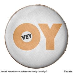 a white plate with the word yo on it and an orange circle in the center