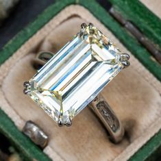 This substantial emerald cut diamond solitaire engagement ring contains one (1) emerald cut diamond weighing 8.00 carats and set into a four-split prong head. The ring measures 15.9mm at the top, rises 7.5mm above the finger, tapering to 2.3mm wide and 1.7mm thick at the base of the shank. The ring is currently size 6. Solitaire Engagement Ring Platinum, Wide Band Engagement Ring, Antique Cocktail Ring, Engagement Ring Platinum, Rings Antique, Marquise Diamond Engagement Ring, Emerald Cut Diamond Ring, Future Engagement Rings, Antique Diamond Rings