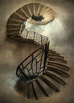 a spiral staircase is shown in this artistic photo