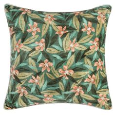 a green pillow with pink flowers on it