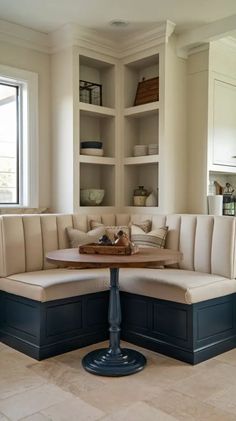 a corner couch with built - in bookshelves is shown