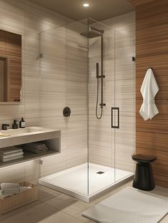 a bathroom with a walk in shower next to a sink