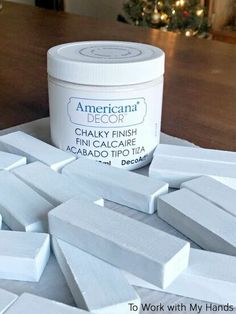 a jar of white chalk sitting on top of a wooden table