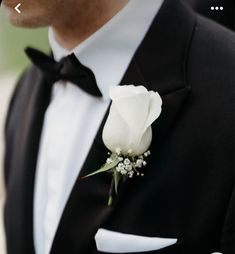 a man in a tuxedo with a boutonniere on his lapel