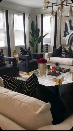 a living room with couches, chairs and a coffee table in front of two windows