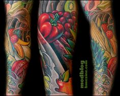 some very colorful tattoos on both arms and legs, with fruits and vegetables all over them