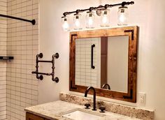 a bathroom with a sink, mirror and lights