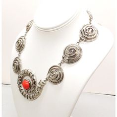 This is part of Chairish’s Costume Jewelry assortment.  1970s Modernist rhodium plated spiral links with cabochon faux-carnelian center and box clasp with a single clear round rhinestone on it necklace. Marked "U.C. Ugo Correani Made in Italy." Center:  2 inches long. Overall measures: 7 1/2 inches long by 5 1/2 inches wide. Interior circumference about 17 1/2 inches. Condition: Very good except that there is crazing to the metal coating on the clasp, which may be a problem at a later date, but Modern Spiral Jewelry For Formal Occasions, Modern Spiral Jewelry For Formal Events, Modern Spiral Metal Jewelry, Retro Silver Metal Jewelry, Vintage Spiral Nickel-free Jewelry, Formal Metal Cabochon Jewelry, Formal Metal Jewelry With Cabochon, Retro Round Cabochon Jewelry, Retro Cabochon Jewelry