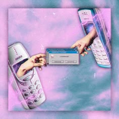 two hands holding a cell phone and a credit card in front of a pink background