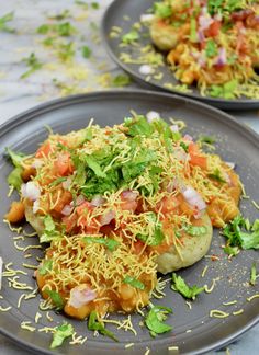 two plates filled with food on top of a table