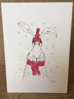 a drawing of a rabbit wearing a red hat and scarf