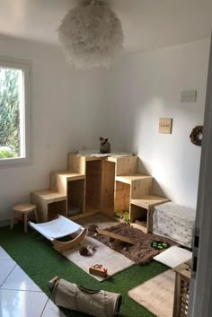 the room is clean and ready to be used as a playroom for cats or kittens