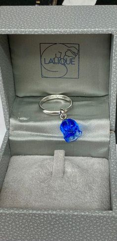 This is a beautiful ring by LaLique, which has never been worn. It was bought originally as inventory at my shop, but then I put it in storage after my shop was burglarized, and just unearthed a box of jewelry! Sort of like Christmas On my ring sizer, it falls between 5 1/2 and five 3/4.  The insert reads as follows "Muguet". in the flower language, lily of the valley is synonym with the return of happiness. This fine and delicate flower was one of Lalique's favorite. He often adored his creatio Flower Language, Ring Sizer, Delicate Flower, Beautiful Ring, It's Fall, Lily Of The Valley, Rings Statement, The Valley, Have A Great Day