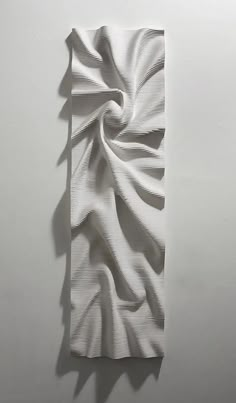 a piece of paper that has been folded in the shape of a wave on it