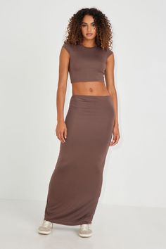 Okay she's versatile.. this hot convertible maxi skirt can also be worn as a sleeveless dress! Features - Slip-on - Semi-sheer - Stretchy Size & Fit - Rise: High-rise - Length: Maxi - Model is wearing size S Materials & Care - Content: 95% rayon, 5% spandex - Care: Machine wash, cold - Imported Brown Maxi Skirt, Brown Maxi Skirts, Softest Sweater, Mock Neck Sweater, Bottom Clothes, Casual Fits, Crop Tee, Summer Wardrobe, Convertible