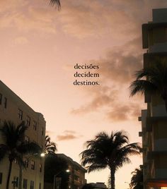 a city street with tall buildings and palm trees in the foreground that reads, desecoes decide dedicem destinos