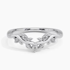 a white gold ring with leaves and diamonds