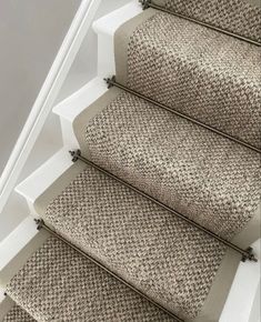 the carpeted stairs in this house are clean and ready to be used