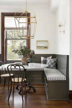 a dining room with a bench and table