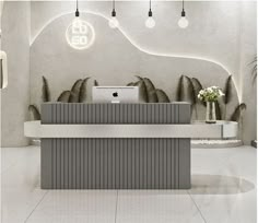 the front desk of an office with white and gray decor on it's walls