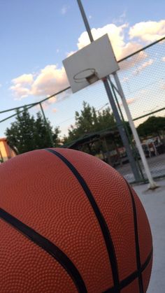 a basketball sitting on top of a basketball court