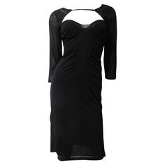 A fabulous black fine stretch silk dress from Tom Ford for Gucci. It has 3/4 length sleeves, slits at the side hem and a fine strap crossing the upper chest and back. There is a ribbon sized sheer panel around the hem and bust. It slips on over the head. Fits size Medium. It is marked size L. Bust 34-37" Waist 28-31" Hips 36-39" Sleeves 20" Length 40" Gucci Black Dress, Tom Ford For Gucci, Evening Dress Black, Tom Ford Gucci, Ant Farms, Gucci Dress, V Dress, Low Cut Dresses, Silk Shirt Dress