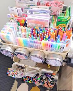 an organized container filled with pens, markers and pencils