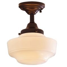 a ceiling light with a white glass shade