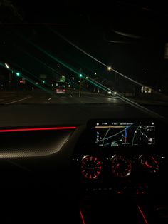 the dashboard of a car at night time