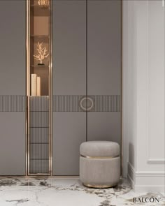 the interior of a modern bathroom with marble flooring and gold accents on the walls