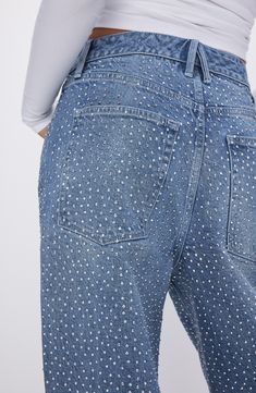 Glistening crystal embellishments dance in the light on these low-stretch wide-leg jeans featuring a faded indigo wash. 33" inseam; 25" leg opening; 13" front rise; 15 1/2" back rise (size 8) Zip fly with button closure Five-pocket style 79% cotton, 20% recycled cotton, 1% elastane Machine wash, tumble dry Imported Black Owned/Founded Denim Blue Straight Leg Jeans With Rhinestones, Denim Blue Rhinestone Straight Leg Jeans, Rhinestone Denim Flare Jeans Straight Leg, Embellished Denim Blue Straight Leg Bottoms, Mid-rise Denim Flare Jeans With Rhinestones, Embellished Straight Leg Denim Blue Jeans, Embellished Denim Blue Straight Leg Jeans, Trendy Straight Leg Flare Jeans With Rhinestones, Crystal Embellished Denim Jeans