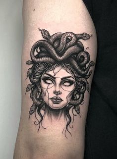 a woman with a snake on her head is shown in black and white tattoo art